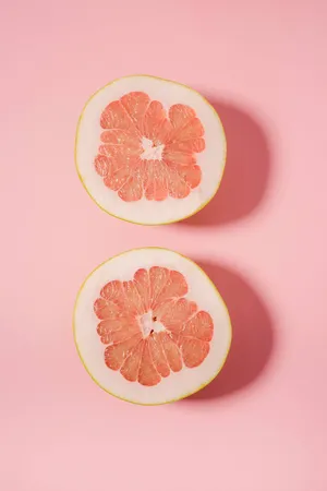 A Slice Of Fresh Pink Grapefruit Wallpaper