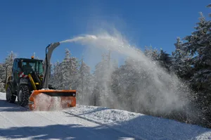 A Snowplow In Action On A Snowy Day Wallpaper