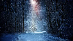 A Snowy Path With A Light Shining Through It Wallpaper