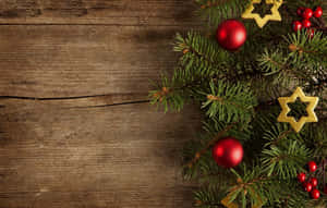 A Snowy Village With Festive Lights During Winter Holidays Wallpaper