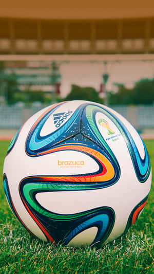 A Soccer Ball On The Grass Wallpaper