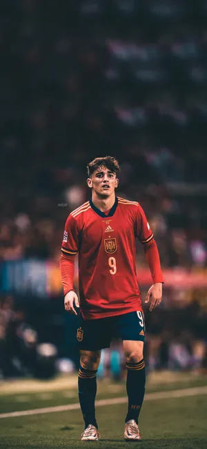 A Soccer Player Is Standing On The Field Wallpaper