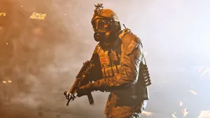 A Soldier In A Gas Mask Is Standing In Front Of A Fire Wallpaper
