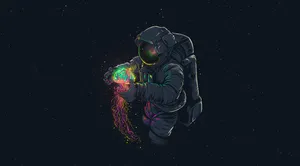 A Spaceman Holding A Colorful Ball Wallpaper