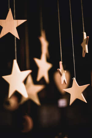 A Sparkling Christmas Star Radiates An Ethereal Glow. Wallpaper