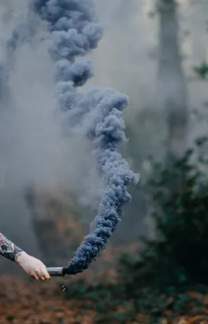 A Spectacular Display Of Smoke Blue Sky Wallpaper