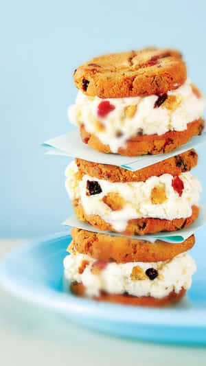 A Stack Of Cookies And Cream Sandwiches On A Plate Wallpaper