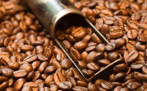 A Steaming Cup Of Freshly Brewed Brown Coffee Wallpaper