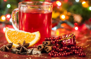 A Steaming Mug Of Mulled Wine With Cinnamon And Orange Garnish Wallpaper