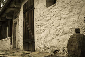 A Stone Building With A Door Wallpaper