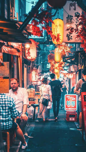 A Street Scene With People Walking Down The Street Wallpaper