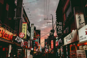 A Street With Many Signs Wallpaper