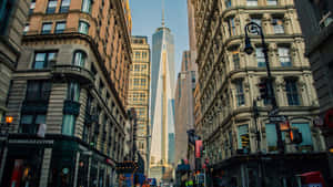 A Street With Tall Buildings And A Tall Building Wallpaper