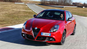 A Stunning Alfa Romeo Giulietta On The Open Road Wallpaper