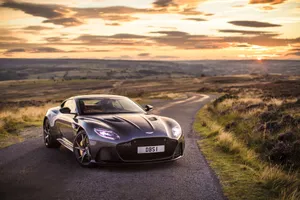 A Stunning Aston Martin V12 Vantage On The Open Road Wallpaper