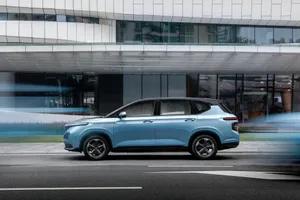 A Stunning Baojun Car On A Scenic Route Wallpaper