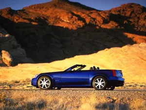 A Stunning Cadillac Xlr Cruising The Streets Wallpaper