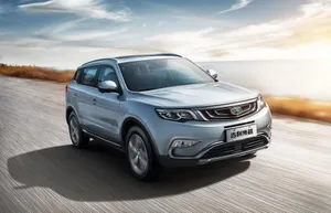 A Stunning Geely Vehicle On The Road Wallpaper