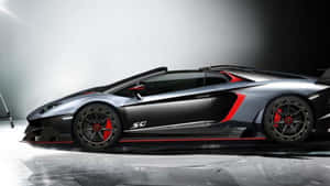 A Stunning Lamborghini Veneno Showcasing Its Sleek Design And Impeccable Engineering Against A Vivid Backdrop. Wallpaper