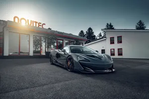 A Stunning Mclaren 600lt In Action On The Road Wallpaper