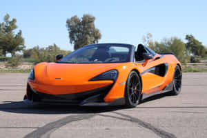 A Stunning Mclaren 600lt Spider Boasts Its Vibrant Design And Power On An Open Road. Wallpaper