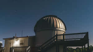A Stunning Night Sky Above The Observatory Wallpaper
