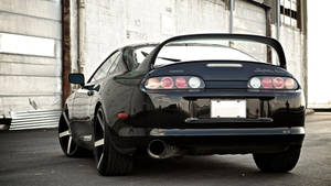 A Stunning Rear View Of The Black 1994 Toyota Supra Mk4 Wallpaper