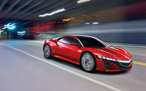 A Stunning Red Acura Nsx Showcased On An Open Road Wallpaper