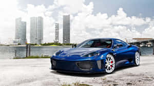 A Stunning Red Ferrari 360 Modena Parked Against A Scenic Backdrop Wallpaper