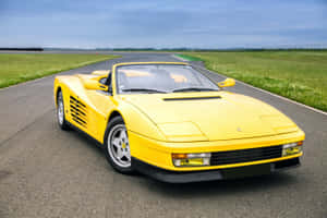 A Stunning Red Ferrari Testarossa Showcased In All Its Glory Wallpaper