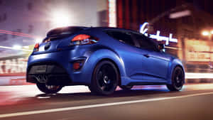 A Stunning Red Hyundai Veloster On The Road Wallpaper