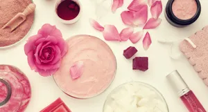 A Stunning Sunrise Overlooking A Calm Body Of Water Wallpaper