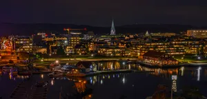 A Stunning Sunset Over Kristiansand Harbor Wallpaper