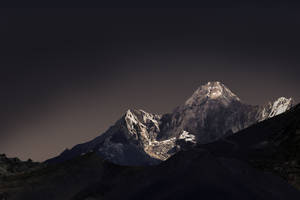 A Stunning View Of A Black Mountain Wallpaper