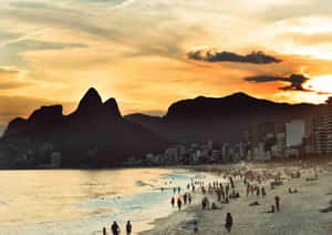 A Stunning View Of A Sunlit Brazilian Beach With Crystal Clear Waters And Golden Sands Wallpaper