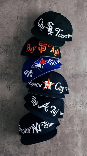 A Stylish Hat Perched On A Wooden Stand Wallpaper