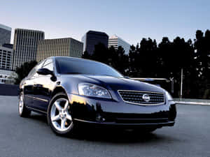 A Stylish Nissan Altima Sedan Showcasing Its Sleek Design And Modern Features Wallpaper
