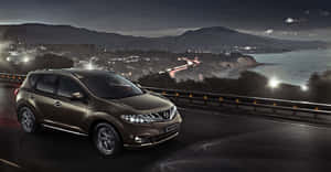 A Stylish Nissan Murano Suv On The Road Wallpaper