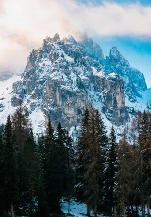 A Sunrise Illuminating The Clouds In Vibrant Colors Wallpaper