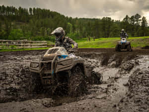 A T V Mud Racing Action Wallpaper