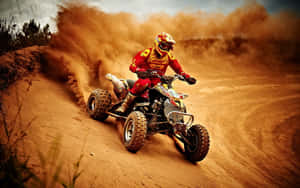 A T V Racer Kicking Up Dust Wallpaper