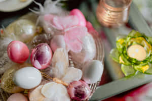 A Table With Easter Eggs And Flowers On It Wallpaper