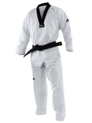 A Taekwondo Student Dressed In A Traditional Dobok Uniform About To Kick. Wallpaper