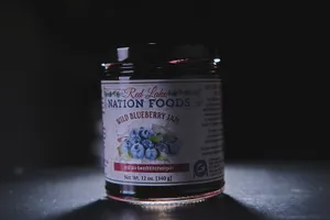 A Tasty Jar Of Freshly Made Blueberry Jam Wallpaper