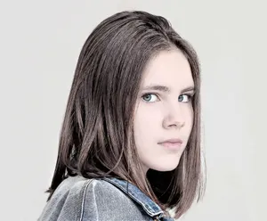 A Thoughtful Teen With Stylish Short Hair Wallpaper