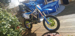 A Tm Racing Motorcycle In Action Wallpaper