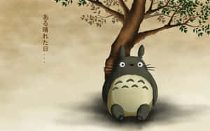 A Totoro Sitting Under A Tree Wallpaper