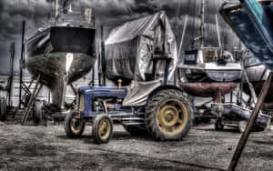 A Tractor Parked In The Dirt Wallpaper