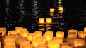 A Tranquil And Serene Landscape Featuring A Small Waterfall And A Body Of Water Wallpaper