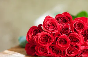 A Tranquil Beach With Blue Waters And Blue Skies Wallpaper